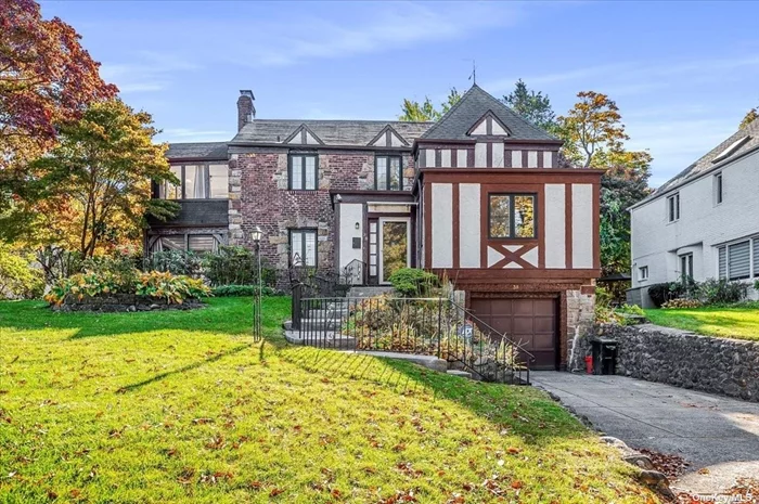 This picturesque brick and stone English Tudor is ideally located In the Strathmore section of Great Neck with a new community playground and the scenic Duck Pond. Full of charm and character, the home offers a welcoming first floor with a spacious living room, a lovely screened porch overlooking a beautifully landscaped private yard, a formal dining room, an expansive eat-in kitchen, and a versatile home office or bedroom. The thoughtfully designed layout blends functionality with generous space for entertaining. Upstairs, the primary suite features a walk-in closet, a cozy sitting area, and a renovated full bath. Two additional bedrooms, one with access to the expansive balcony. Recent updates include a brand-new gas boiler and an oxygen sauna. Enjoy all the wonderful amenities of the Great Neck Park District, including the Parkwood Olympic pool, Lazy River, ice skating, tennis, summer camp, and access to Steppingstone Waterfront Park and Marina.