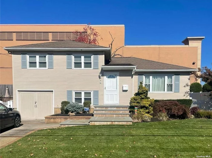 Step into this bright and sunny split level home in Massapequa School District. Home features an eat in kitchen with a gas stove (gas is in the home) formal dining room and living room with hardwood floors throughout.. Lower level has large family room with an outside entrance and powder room.. Upper level has 3 bedrooms-primary can fit king bed, full bath. The yard and the home layout is great for entertaining. Don&rsquo;t miss this beautiful home!