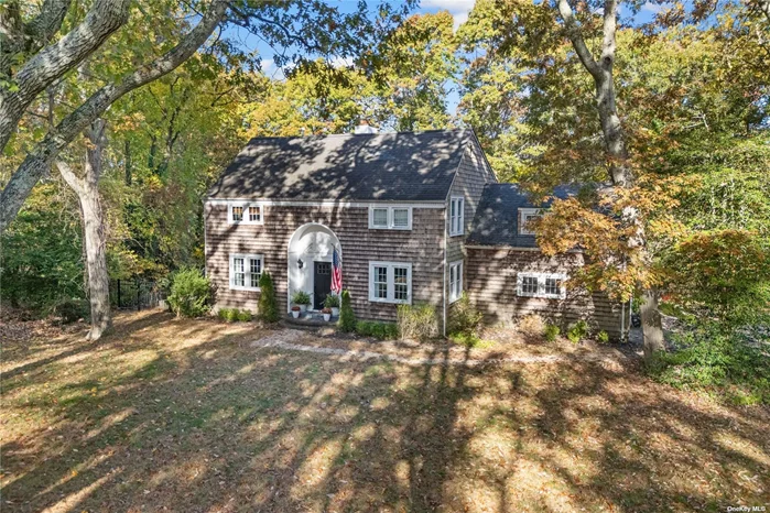 This 1930&rsquo;s colonial in Old Field South combines old world charm with modern amenities. The cedar shake home is nestled behind a wooded island which provides privacy and a manor like feel. The home is impeccably decorated. The living room features built in cabinetry and bookshelves with a fireplace and French door that leads to a covered porch. The dining room is formal and connects to a wet bar. The kitchen and family room connect with spacious windows, wide plank wood floors, a stone fireplace and French doors that lead to a deck which overlooks the yard and pool. This is a stunning home only a mile from West Meadow beach. It is close to all Three Village schools and Stony Brook village. This is governed under the covenants of Old Field South- with a $100 annual fee.