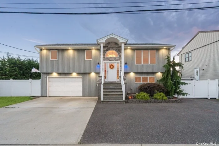 Welcome to a true boater&rsquo;s paradise in the heart of Seaford! This stunning three-bedroom, two-bathroom, waterfront High-Ranch positioned on a spacious lot with 75 feet of bulkhead provides effortless water access for all your boating needs. The open concept main level showcases beautiful, refinished wood floors and Anderson windows that fill the space with natural light. All closets are complemented by organized California Closet systems throughout. The bathroom has been newly renovated and has upgraded heated lights for added comfort. The kitchen features granite countertops, stainless steel appliances, and a trash compactor. The newly renovated lower-level den is perfect for cozy gatherings or guest stays. It features new tile flooring, raised outlets, a woodburning stove, and a sliding door that leads to the outdoor space. This area includes a full bath for added convenience as well as garage access. The home is powered by a 200-amp electrical panel and equipped with gas heating, and 2-zone sprinkler system. Ample parking is available with a 4-car driveway and a 2-car garage. The luxurious waterfront yard has an awning area that provides a shaded retreat for sunny afternoons. A new floating jet ski dock adds convenience, while an expansive Trek deck and a freshly lined pool invite you to relax and entertain outdoors. From well-appointed interiors to water-loving amenities, this home provides the perfect setting for a luxurious and active waterfront lifestyle. Conveniently located near major parkways, the LIRR, restaurants, parks, and local shops. Don&rsquo;t miss the opportunity to make this boater&rsquo;s paradise yours just in time for the 2025 season!