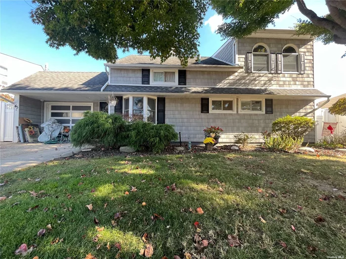 Large Expanded Ranch In Division HS Section of Levittown. 5 Bedroom, 3 Up and 2 Down, 2 Full Baths. Beautifully Landscaped and Well Maintained. New Siding, New Roof, New Hot Water Heater, New Boiler.