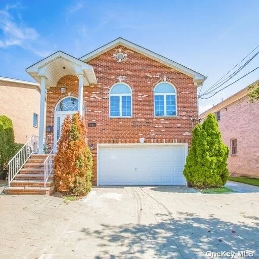 Welcome to this stunning, custom-built, two-story brick residence in the heart of Whitestone, meticulously renovated with top-tier imported finishes and premium appliances, including Miele, Bertazzoni, and Viking. The home radiates elegance and modern sophistication, starting with a grand foyer and custom walnut flooring that set a luxurious tone from the moment you enter. The upper level boasts four spacious bedrooms and two bathrooms, including a master suite complete with a walk-in closet. The expansive, high-ceilinged living room is both beautiful and functional, offering a welcoming and refined space for relaxation and gatherings. On the lower level, the open-concept kitchen combines elegance with functionality, featuring radiant heated floors, a large granite island, a premium appliance suite, and custom cabinetry. Adjacent to the kitchen, the cozy family room opens seamlessly to the tranquil patio and backyard through glass doors, perfect for effortless indoor-outdoor living. The spacious walk-out lower level offers abundant closet and storage space with additional access to the backyard. The versatile unfinished basement can be customized to suit the buyer&rsquo;s preferred use. Outdoor spaces are thoughtfully designed for entertaining, and the home includes central air and an attached two-car garage. Every detail has been thoughtfully crafted, with custom walnut flooring throughout and bathrooms enhanced by walnut cabinetry, adding a refined, cohesive aesthetic. A beautiful staircase with imported walnut steps leads to the upper level, where you&rsquo;ll find four spacious bedrooms and two bathrooms, including a luxurious master suite complete with a walk-in closet. The expansive, high-ceilinged living room is designed to offer both beauty and functionality, creating an inviting space for relaxation and gatherings. Conveniently located near Francis Lewis Park and just minutes from major highways and bridges, this exceptional home blends timeless elegance with modern convenience, creating an unparalleled living experience.