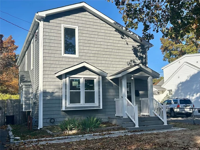 New Roof Siding and Windows, New Baths, Hardwood Floors, Basement, Rear Paver Patio.