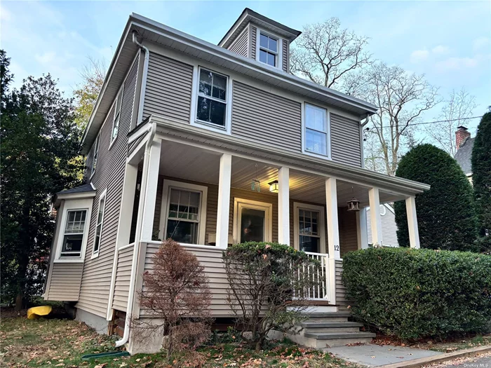 Classic colonial home with 3 bedrooms and 2 full baths boasts beautiful hardwood floors. The new kitchen and first-floor bath have tiled floors with radiant heat. The finished and freshly painted half basement offers great office space or rec room. Dine al fresco on the patio or the expansive granny porch. This lovely home is energy efficient with new boiler, water heater and Energy Star appliances. Private driveway parking for 2 cars. Conveniently located just blocks from the village, parks and beaches.