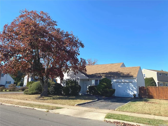 Daylight savings time is over, and so is the search for your new home with so much potential. This conveniently located property has been in the same family for decades. The floor plan has many possibilities to open up or to expand. This corner, 71 by 98 foot property,  is situated on a quiet street with well kept homes with great curb appeal. Enter through the portico of the front door to the main level with kitchen, dining area, coat closet, and living room with a beamed vaulted ceiling and large bay window. The second floor has three bedrooms and a full bathroom with shower/bathtub combination. The lower level has a spacious recreation room with convenient access to the attached garage with storage and access to the fenced in backyard. A half bathroom, laundry and utilities room complete this floor. Seize this opportunity to purchase this well priced home in a community that offers so much. Massapequa Park has an abundance of eateries, shops, services, parks, and is in close proximity to the LIRR station. The holidays are fast approaching Take advantage of numerous activities and events year round in the beautiful village, or throughout the coveted Town Of Oyster Bay.