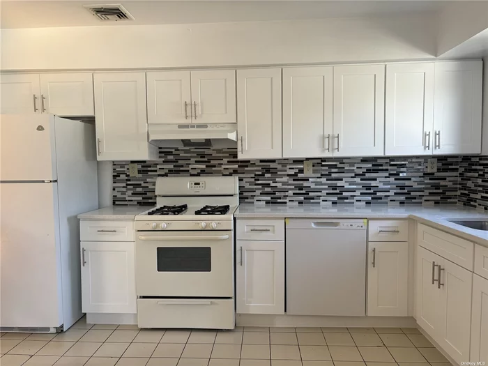 Spacious 3 bedroom apartment on 2nd floor in private home. All new eat in kitchen, 1 1/2 baths, Hardwood floors, fireplace, washer / dryer in apartment All newly painted and Super Clean Sunny Apartment.