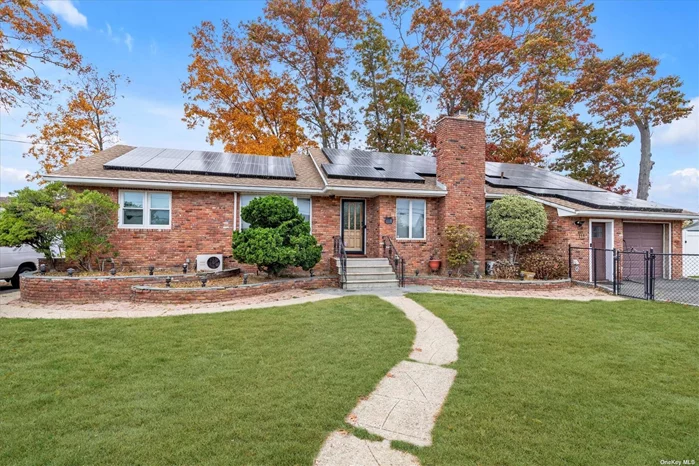 Sprawling brick ranch in the heart of Copiague! Most INEXPENSIVE house to run thanks to Geothermal heating and cooling and fully owned solar panels...utility costs are under $50 a month! This dream home also includes an updated kitchen, primary with an updated full bath complete with steam shower and body jets. Other updates include- roof @10 years old, windows 2 years old, new attic insulation central vac and a gas line for the BBQ - Smart features include - whole house water shut off, smart link light switches, exterior cameras, wifi garage door opener and more. The basement is perfect for entertaining with the theater room complete with 120 inch screen and built in speakers and other areas for work, play, guests and storage. The house has 2 driveways and a garage for parking - as well as a hook up for a RV. This house is smart and green- the perfect combination!