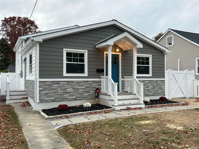 Newly Restored and Renovated 3 Bedroom, 2 Bath Split Level, Open and Airy with Beautiful Hardwood Floors and Modern Gourmet Kitchen, Central Air Conditioning, New Roof, Windows, Siding and Stone Work. All New Appliances, Washer and Dryer Included!