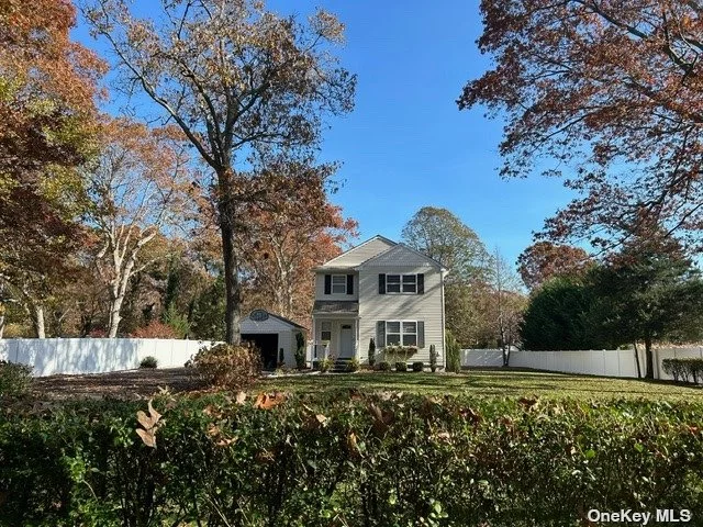 This lovely colonial-style home offers the perfect blend of charm and modern updates, having been renovated in 2018. With 3 bedrooms and 2.5 baths, it sits on a beautifully landscaped 1/2-acre lot surrounded by durable PVC fencing. The large driveway, detached garage, and inviting backyard patio provide ample outdoor space for relaxation and entertaining. Upon entering through a slate walkway, you&rsquo;ll find a welcoming main floor with a spacious kitchen featuring propane cooking, an island, pantry, and stainless steel appliances. There&rsquo;s also a formal dining room, a cozy living room, and a convenient half bath. Upstairs, three bedrooms await, including a master suite with its own bathroom, along with an additional full bath for the remaining bedrooms. The home also offers practical features like Bilco doors for easy access to the basement area housing the boiler, water heater, and electric panel, with extra room for storage. Situated just a few miles from Smith Point Beach, local parks, the marina, and the LIRR, it&rsquo;s conveniently close to shopping and recreational options, making it a fantastic place to call home.