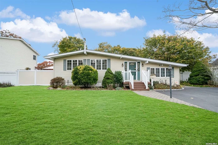 Come see this beautiful California Ranch style home in Ronkonkoma! This home has many new improvements including new eat in kitchen and a new roof! Starting out - the private driveway overlooking the well manicured lawn to the front door entryway. Immediately to the right we have a cozy and spacious great room with a fireplace. Possibilities are endless also considered for a dining room entertaining many guests. Through the hallway into the recently remodeled eat in kitchen you will find a living room and ample storage closets. A full bathroom down the hall as well as a half bathroom too. 3 spacious bedrooms which are perfectly sized. Downstairs you will find a lounge area, awaiting the new homeowners touch along with the laundry room and 3 extra rooms. There is no shortage of storage in this home. Come outside and you will find a deck and Gazebo where you may relax and unwind. Completely flat and fenced in yard. This Property has an 8 zone sprinkler system and a whole house water filtration system. This home has hardwood floors, Quartz countertops, carpet in the bedrooms, a new kitchen, all Natural Gas and ready for you!