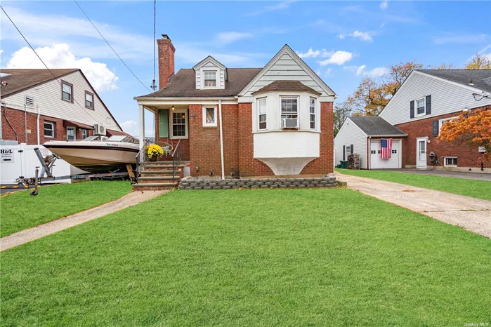 Welcome to 4 Edward Street in Lynbrook, NY. This Brick Cape Cod home first floor features entry foyer with coat closet, living Room w/wood burning Fireplace, Dining Room, Kitchen w/newer Appliances, Primary Bedroom, Additional Bedroom and Full Bathroom. Two additional bedrooms with large closets and ample storage on the upper level. Full basement with outside entrance offers utilities, high ceilings and plenty of storage. 1 Car Garage, Private Oversized Fenced Yard, Solar Panels, rear porch and patio with a deep yard in SD#12. Conveniently located near the Long Island Railroad Stations and minutes from the Southern State Parkway, shopping, restaurants, parks. This property is ready to welcome you. Come and see for yourself what makes 4 Edward Street, Lynbrook so special. Your new home awaits! NO VILLAGE TAXES!! Taxes exclude STAR.