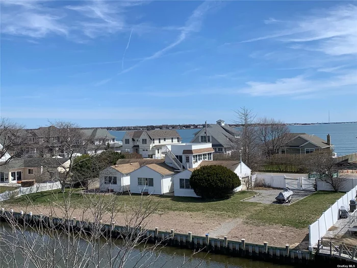 Double lot 150 X 150, possible conforming sub-division, newer vinyl bulkhead, steps to private beach. Assume house needs everything. Incredible location endless possibilities.