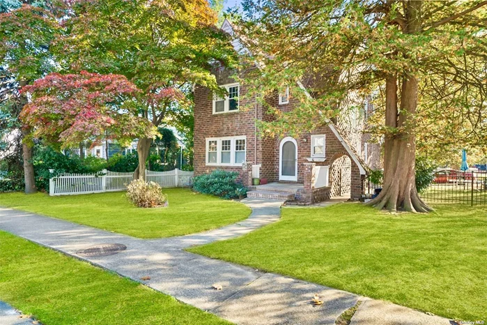 In the heart of Malverne, this all-brick Tudor home on a corner lot exudes timeless charm and character with solid craftsmanship and endless potential. Lovingly held by the same family for years, this home is ready for a new owner to infuse it with personal touches. From the moment you step up to the inviting front entrance, you&rsquo;ll feel the warmth and classic elegance of this property. Inside, the grand entry foyer welcomes you with hardwood floors that flow throughout the home. The expansive living room, a sun-filled space with high ceilings, centers around a beautiful wood-burning fireplace-a perfect spot for gathering with friends and family. The formal dining room, generous in size and character, provides an ideal setting for hosting holiday dinners and celebrations. Just off the dining room, the spacious kitchen awaits a personal touch, with plenty of potential to become a chef&rsquo;s dream. Nearby, a cozy breakfast nook captures morning light, making it a charming spot for coffee or casual meals. Toward the back of the home, a bright and inviting sunroom is perfect for use as a study, office, or a tranquil retreat. There is also a powder room/half bath on the first floor Upstairs, you&rsquo;ll find three large bedrooms, each retaining the warmth and character of original hardwood floors. There is also a full bathroom compleating the second floor. One of the true wow factors of this home is the walk-up attic on the third floor. A rare find, this attic is a remarkable space with soaring vaulted ceilings, filling the room with a sense of grandeur and possibility. Imagine transforming this unique feature into a sprawling master suite, a family game room, or a work space the potential is limitless and ready to inspire your vision. Adding to the appeal, the home also includes a massive detached two-car garage accessible from the side, paired with a driveway that can accommodate up to 6 vehicles-a standout convenience for family and guests alike. The full basement spans the entire footprint of the house, providing abundant storage or space for future enhancements. Located in one of Malverne&rsquo;s most charming neighborhoods, the home is close to transportation, shops, and dining, offering the perfect blend of suburban comfort and city convenience. While this home needs a bit of TLC, it presents an incredible canvas for the discerning buyer to create a one-of-a-kind residence. Don&rsquo;t miss the opportunity to make this Tudor gem your own in the heart of Malverne.