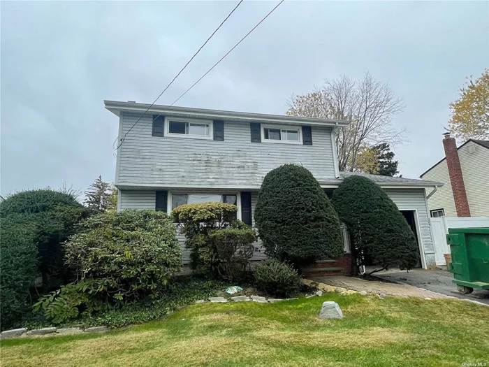 Opportunity awaits in this Colonial style home boasting 3 Bedrooms, 1.5 Baths, Sunken Den, Elk W/Pergo Flooring, Vinyl Windows, Wood floors under upstairs carpets, Gas heat, Full Basement, 1 Car Garage,  & Fenced Yard. WILL NOT LAST. Investor or Handyman Delight!!