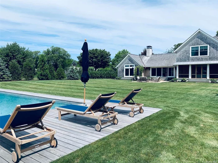 Discover the finest rental property in the charming hamlet of Orient, on Long Island&rsquo;s desirable North Fork. Built in 2017, this exceptional home combines a clean, contemporary aesthetic with breathtaking architectural detail, perfect for discerning guests.The first floor features an open-concept living space with soaring ceilings, anchored by a gourmet chef&rsquo;s kitchen with premium appliances and a spacious island, ideal for cooking and entertaining. A cozy fireplace in the living room and a sophisticated dining area make for a warm, inviting atmosphere. The main level also includes a luxurious primary suite with an ensuite bath showcasing a carved vanity, as well as a small, convenient office.The upper level offers two light-filled bedrooms and a beautifully crafted stone bathroom, perfect for family or guests. The exquisitely finished lower level provides a relaxing escape with its sauna, another stone bathroom, and a spacious open area complete with a dining table and sectional seating-an ideal space for entertaining or unwinding. Step outside to the oversized, private yard, thoughtfully screened with mature evergreens. The outdoor amenities include a stunning 20 x 50 heated gunite saltwater pool, a wood deck for lounging, and a charming pool house finished with barn siding, slate flooring, and its own bathroom. This luxurious home is the ultimate North Fork retreat for those seeking beauty, privacy, and sophistication.