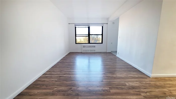 Sun Drenched , Totally Renovated, Move in Ready Spacious Studio in The Heart of Rego Park. Oversized Windows. New Kitchen with Double Sink. New Floors. Renovated Bathroom with Porcelain Tiles & Standing Shower. Custom Made Closets. Very Well Maintained Soundproof & Fireproof Building. Live-in Super, Laundry at Lobby Level, Bike Room, Parking With Waiting List. Can be Sublet After 2 Years. Close to Schools, Parks, Subway, Busses, Shopping & Entertainment.