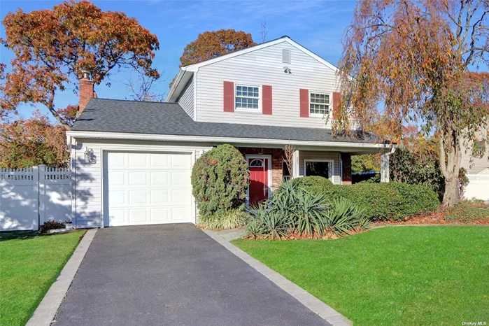 Move right in to this bright and sunny colonial. This home features a covered porch area and entryway leading to the living room with a beautiful bay window, dining room with french doors that leads to outside deck, Updated kitchen with extra tall cabinetry and an abundance of storage. The den features a brick fireplace with gas insert and beautiful new sliding doors leading to the deck and an updated 1/2 bath. Laundry off the kitchen. Upstairs you will find bamboo floors, 3 spacious bedrooms, and a luxurious bathroom with vaulted ceilings and walk in shower. Sun tubes add additional natural light to this space. Newer roof, tilt in windows, CAC, New Gas heat. Wood deck and fenced in flat backyard. tree lined block with sidewalks and Just minutes away from the beautiful Lake Ronkonkoma. Convenient to Hwys and transportation. Sachem School District