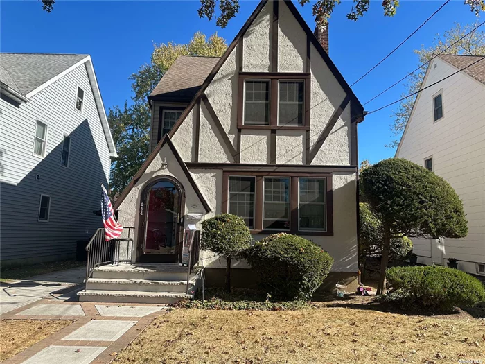 Welcome to this Charming Tudor nestled in the heart of the Village. This home featurees a spacious Living Room with parquet floors that opens to a Formal Dining Room offering plenty of room for entertaining.. Updated Kitchen with a cozy nook with sliders to the backyard. Large Primary Bedroom plus two additional bedrooms and full bathroom on the second floor.  There is a large walk up attic that can be finished to make additional bedroom/office or den. Full Basement with Laundry Area, Utility Room. and plenty of storage space.  Close proximity to schools, shopping, restaurants, parks and transportation..