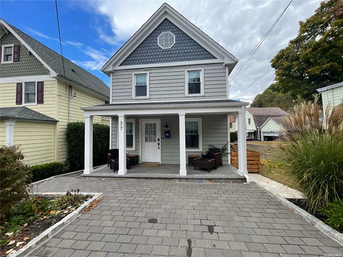 This Charming Colonial is Waiting For You! Steps Away from Historic Downtown Oyster Bay! All Updated and Renovated within Past Two Years. Main Floor Living Room with Gas Fireplace, and Large Open Floor Plan. Weathered White Oak Stained Wood Floors, and Lutron Lights Throughout. Eat-In Kitchen with Brand New Appliances. Gas Cooking Range w/Air Fryer, Full Bathroom and Door to Yard. Finished Basement w/Bilco Door Access. CAC Updated 2022: Second Floor. Ductless Split Units A/C & Heat Main Floor and Basement. Updated 2023: NTI Gas On-Demand Tankless Water Heater. Upgraded 200 Amp Electrical. EV Car Charger. FInished 9x11 Shed with Heat and AC Split Unit. Fenced Backyard w/Brand New Pavers. Brick Driveway, Front Porch amd Back Patio By Shed. MUST SEE!!!