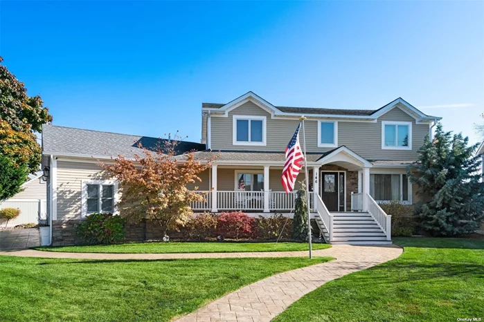 Beautifully Raised and Rebuilt in 2016 This Elegant Waterfront Colonial Home in The Nassau Shores Section of Massapequa Has A True Beach House Feel. As You Approach This Home You Will Notice The Beautiful Landscaping, Hardy Siding and Stone Facade as Well as The Relaxing Trex Porch, and Stamped Concrete Walkways, and Driveway. As You Step Inside This Wonderful Home Which Boast Four To Five Bedrooms and Four Full Baths You Will Notice The Open-Floor Plan Feel Highlighted By The Expansive Kitchen, Living Room With Fireplace, Large Dining Area and Wet Bar. The Primary Ensuite Bedroom Has A Walk-in Closet With Ample Built-in Drawers, A Relaxing Sitting Area, Beautiful Bath Complete With Jet Shower Features. As You Step Through The Sliders To Your Own Private Deck You Can Relax Either At End of The Day or Enjoy Those Magnificent South Shore Sunrises. The Second Floor Bath Offers A Relaxing Jacuzzi Tube and A Walk-in Shower. There Are Dark Hardwood Floors, Beautiful Tiled Floors, Hi Hat Lighting Throughout, as Well as CAC, Central Vac, Extensive Molding and Millwork, as Well as Plenty of Storage. As You Enter The Backyard You Can Relax on The Deck and Also Take in The Morning Sunrises, Relax in The Paver Enclosed In Ground Pool, or Have A Cookout At Your Outdoor Kitchen With a Peninsula For Guests To Sit. There is Also a Gazebo For The Shade Lovers, A Hot Tub, Water Access For The Boat and Jet Ski Enthusiasts and Your Own Slice of Private Beach With A Gas Fire Pit. This Is Truly A Very Special Home and One Not To Be Missed.