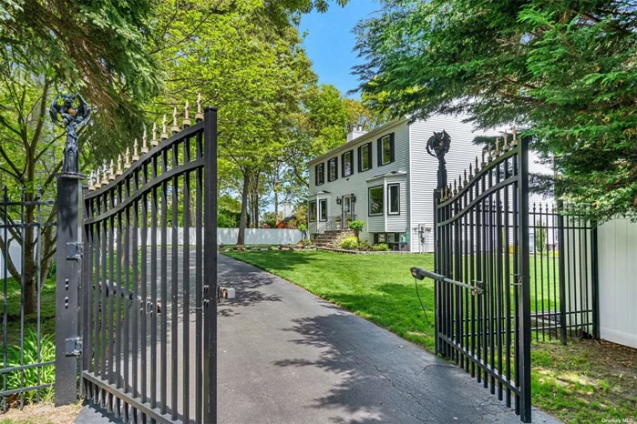 Meticulously designed home awaits your arrival just beyond the Private Gate. This 3700 Sqft. Home Sits on Just Under A Half Acre of Property & Has So Much To Offer. The Entry Foyer, Formal Dining Room, & Living Rm. Share Porcelain Flooring. Crown Mouldings Throughout the home. Minka-Lavery light fixtures illuminate your home with Elegance & sophistication. For the Chef in the family, Experience Warmth & Comfort In The Kitchen with Radiant Floors, Custom Cabinetry from Kraft Made & Schuler & Kitchen Aid Appliances for High Performance Cooking. Gas Stove, Granite Counter Tops, Convection Ovens, Recessed Lighting & Plenty of Storage Space. Laundry Room with Samsung Washer/Dryer Oversized French Doors To The Rear Deck. Convenient to Restaurants, Shopping, Schools, and Access To Major Roadways.