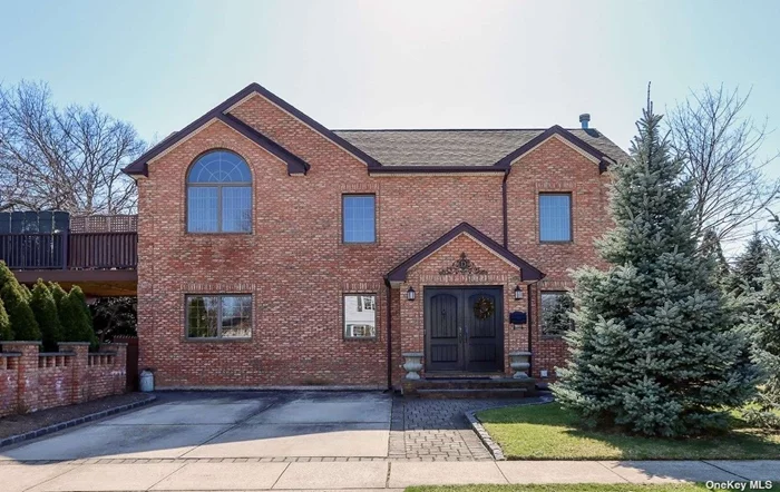 Welcome to this expansive brick colonial on a corner lot in North Merrick! As you walk in you will be greeted by a foyer that leads to a formal living room and dining room. Warm and cozy den has a wood burning fireplace and 2 sets of french doors will take you out to the backyard. The kitchen was designed with imported Italian cabinetry, granite countertops and an center island with seating. The back room that extends off the kitchen has a full bathroom and offers more counter and cabinet space with a door to the backyard. The second level has a primary bedroom with a cathedral ceiling, 2 closets and a sliding door to a private 2nd level trex deck. The bathrooms all have tiled floors. The basement is fully finished with 2 rooms, laundry and utilities with an outside entrance. Tile flooring on 1st floor and hardwood on 2nd floor. Anderson windows throughout, 2 zone gas heating, Central AC, 6 zone in ground sprinkler system, and 200 amp electric. The private backyard of this property is fenced in with a covered patio off the side of the home with barbecue and garden areas. This home has everything to make you relax and enjoy the different seasons, Close to parkway.