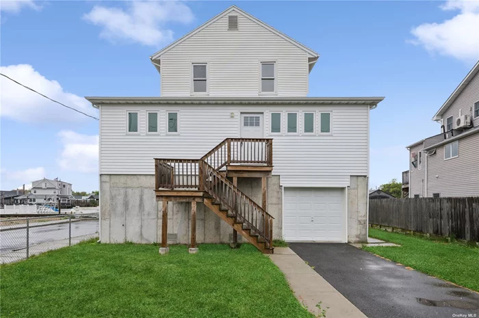 Charming, renovated colonial in Meadowmere Park, Lawrence! This 4-bed, 2-bath home offers stunning waterfront views, a private bulkhead, and a spacious lower level with high ceilings and reinforced foundation. Conveniently close to Stop & Shop, Lowe&rsquo;s, Costco, and minutes from NYC. Nearby public transit and local fire department add ease and security. Enjoy luxury and tranquility with a long driveway and large garage. Virtually staged images included. Its a Must See!