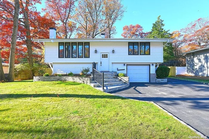 Welcome to your beautifully renovated dream home in the desirable Tulipwood section of Commack. This stunning property features brand new everything from the light and bright modern kitchen with stainless steel LG appliances and Quartz countertops to the three luxurious bathrooms and the generously sized primary ensuite with gleaming hardwood floors throughout. The living/dining room centerpiece is the wood burning fireplace for cozy winter nights and brand new central air for those hot summer days. Vaulted ceilings, recessed lighting, new doors, new walls, new siding, 1.5 car garage with brand new washer and dryer,  Dont miss out on this opportunity to own a completely updated gem. Call to schedule your showing today.