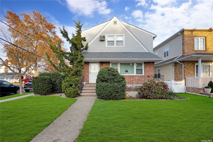 Welcome To This Beautiful Potential Mother/Daughter Home in New Hyde Park, In An Award Winning School District! Entry Foyer Guides You Into The Welcoming Livingroom On The First Level Or You Can Proceed Upstairs To The Second Living Space. The Spacious Livingroom Draws You In With Beautiful Oak Hardwood Floors Throughout The Home. The Living Room Is Open To The Dining Room With An Open View Of The Bright, Eat In Kitchen. There Are 3 Nicely Sized Bedrooms. The Primary Bedroom Includes A Beautiful Updated Half Bath With Gorgeous White Tile Floor With Gold Accents! You Will Find Two More Additional Bedrooms, Both With Ample Closet Space. A Large Updated Full Bath Complete This First Level. Upstairs, You Will Find An Additional Living Space With Oak Hardwood Floors Throughout. Updated Eat In Kitchen With Updated Appliances. Slightly Larger Living Room As Well As A Dining Room With Open View To The Eat In Kitchen. Beautifully Updated Full Bath And 3 Nicely Sized Bedrooms With Ample Closets. In Addition, You Have An Attic With Pull Down Stairs For Ideal Storage. This Is A Great Living Space For The Extended Family. This Home Boasts A Spacious Full Finished Basement Complete With Cabinetry, Laundry, Utilities, A Beautiful Full Bathroom with White & Gold Tile and Fixtures. Decorative Fireplace Is A Nice Addition To the Space. The Fireplace Surround/Door is excluded from the sale. This Vast, Open, Bright Space Is The Perfect Recreational Space Complete With A Wet Bar. Maintenance Free Backyard And 1 Car Detached Garage Make This Home Special. Close Proximity To Schools, Shopping, Houses of Worship, Mass Transportation & Highways. Taxes Have Not Been Grieved!