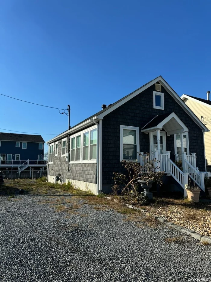 A boaters dream location! This updated cape is one house off the Great South Bay on a private canal with room for dockage. Home was updated in 2021 - new roof, siding, kitchen, flooring. This property has a spacious design with room to grow. Very private location, ample parking, and amazing views. This would be a great starter home or perfect for those looking to downsize. Shore Road park is steps away with fields and new play ground. Don&rsquo;t sit on this one!