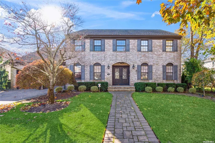 Welcome to this stunning, renovated home in one of the most desirable sections of Rockville Centre. Nestled on a quiet block adorned w/decorative street lamps, this property offers elegance with modern luxury. Greeted by a grand entry foyer inviting you into a home designed for both comfort and style. A generously-sized formal dining room and spacious living room featuring gas fireplace, built-ins and custom window treatments. French doors lead you to a family room with a stone, wood-burning fireplace, seamlessly opening to a gourmet eat-in kitchen that boasts stainless steel appliances, double oven, oversized fridge, quartz countertops, large island w/breakfast area and sliding glass doors leading to the private backyard. Enjoy the convenience of a touch faucet w/filtered drinking water, under-cabinet lighting, and pantry. Perfect for entertaining, the home features a dinner party flow, wide wraparound staircase and beautiful hardwood floors throughout. The main level includes a powder room, laundry room w/additional backyard access and a bedroom currently set up as an office. Second floor hosts four spacious bedrooms, including a master suite w/sitting area, expansive walk-in closet (WIC) and luxurious ensuite bath featuring oversized stand-up shower, soaker tub, double sinks and radiant heat. The master suite also offers a huge bonus room, perfect for a glam room, gym, or additional WIC. Three additional bedrooms feature generous storage w/large WICs, complemented by an updated full bathroom. A full basement w/a high ceiling provides endless possibilities, while a Sonos sound system enhances entertainment on the 1st floor and outdoor space. This home boasts an abundance of storage complete w/a two-car, oversized garage offering direct home access. Situated close to the Rockville Links Golf Club, this property personifies upscale living, blending privacy and luxury.