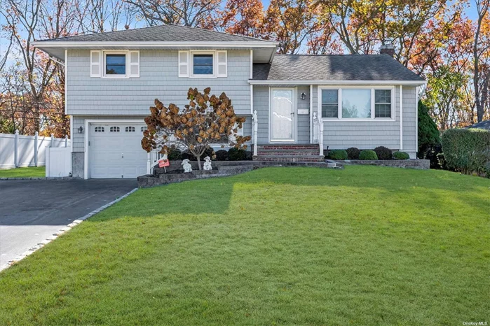 New Renovated, Beautiful mid-block Split house has 3 bedrooms, 2 bathroom. Commack School district. One car garage, big yard. Closed to park, shopping.