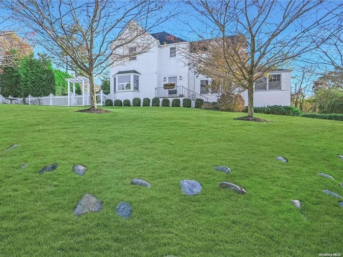 Welcome to this enchanting 1929 classic colonial nestled in the desirable Bay Hills community of Huntington Bay. This charming home, completely renovated in 2017/18 and continuously updated since, seamlessly blends timeless elegance with modern comforts. Offering 3 bedrooms and 1.5 baths, the residence boasts light-filled spaces, detailed moldings, and peeks of waterview&rsquo;s that create a serene ambiance. Step inside to discover a bright and airy layout featuring a brand-new kitchen, perfect for culinary enthusiasts. The inviting living room is highlighted by a stunning stone fireplace, ideal for cozy gatherings. The stucco exterior and professional landscaping enhance the home&rsquo;s curb appeal, making it truly move-in ready. Enjoy the convenience of an outdoor shower, perfect for rinsing off after a day at the beach. As a resident of the Bay Hills Beach Association (fee), you&rsquo;ll enjoy an array of amenities including tennis courts, pickleball, summer camp, kayak storage, playgrounds, basketball courts, and more. With mooring rights and a vibrant community offering activities for all ages, this home is not just a residence but a lifestyle. Additionally, the Huntington Bay area provides the added security of a private police force, ensuring peace of mind. Don&rsquo;t miss the opportunity to experience the best of coastal living in this beautifully renovated and meticulously maintained colonial. Low taxes.