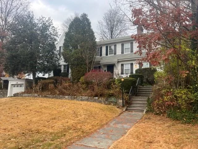 Welcome to 52 Laurel Place! This charming Colonial-style home has been lovingly maintained by its current owners for over 60 years. You&rsquo;ll find original details throughout, including exposed beams, period features, hardwood flooring, and a butler&rsquo;s pantry. Situated on a sloping hill with a level backyard, it&rsquo;s perfect for sledding. Conveniently located near all that New Rochelle has to offer, including the train station, library, restaurants, and shopping.