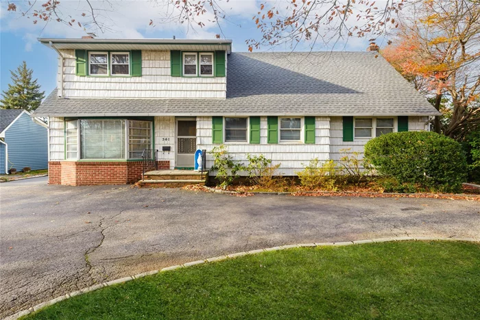 Bring your imagination to this cape cod home and make it your own in the Carle Place Schools. This versatile layout can suit many needs. Whether its private home office or lots of bedrooms, you can have it! The entry foyer leads to a living room with bay window and large stone fireplace. There is a formal dining room with built-ins,  and the kitchen has stainless steel appliances. There are three bedrooms on this level and a full bath. Upstairs is an additional two bedrooms, den/home office and lots of storage. Downstairs to the partially finished basement with large laundry room, den, utilities and more storage. The oversized detached garage has great storage and there is a very private backyard with slate patio, with a green house!! Additionally, there is a circular drive for lots of parking. Conveniently located to LIRR, all major parkways, shopping, dining and more!