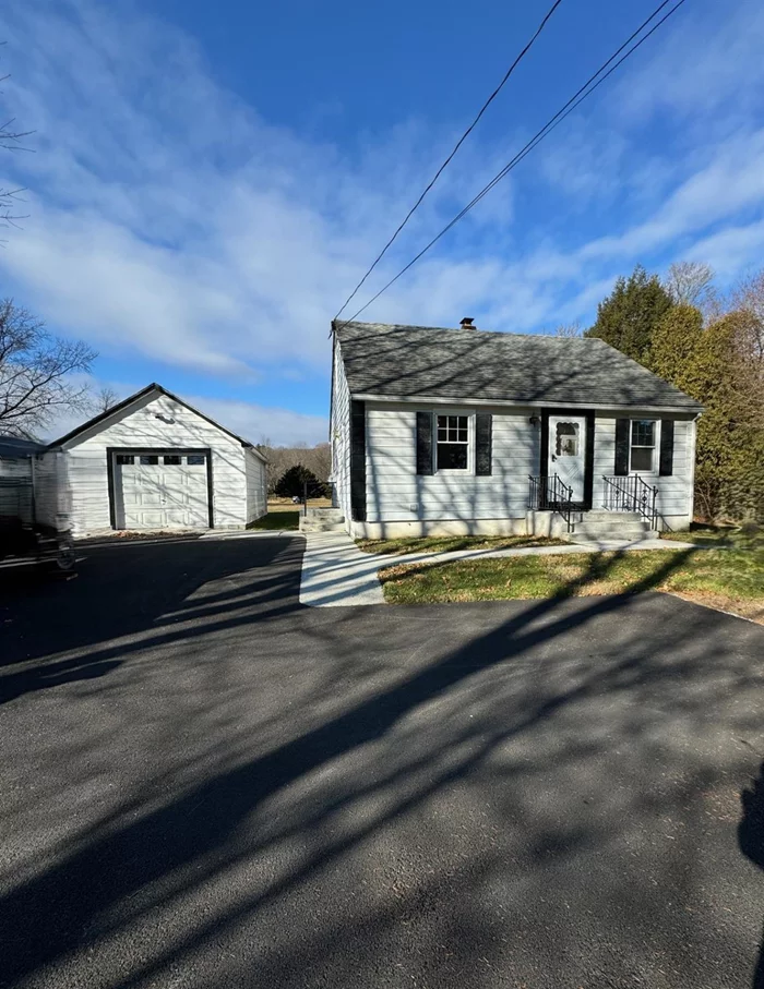 This charming Cape Cod features a beautifully level backyard and a one-car garage. Inside, the welcoming space boasts a sunlit living room, an updated kitchen with wood cabinets and a breakfast bar, as well as a first-floor bedroom and bath, all with recently finished wood floors. The home also offers peace of mind with updated mechanics, including a new furnace, water softener, and water holding tank. Conveniently located near shopping, hiking trails, the train station, and the hamlet of Wassaic, this home is ready for you to move in and enjoy!