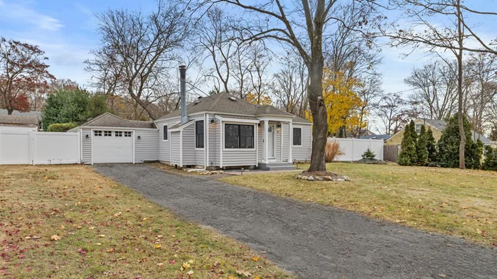 Welcome to this adorable Sound Beach cottage in the sought after Miller Place School District. Located mid-block on .23 acres of level land with easy access to shopping and highways. Enter into the main living area that is warmed with a wood-burning fireplace and custom mill work. Enjoy open sight lines into your eat in kitchen with granite countertops, ample prep space, and custom finishes. The primary bedroom is located on the main level with large windows, double closets and a hidden washer and dryer. Full bathroom with wainscotting and standup shower. Finished basement is versatile with walk-out egress and has potential for extra sleeping arrangements, an office, and more living space as well. The back hallway provides enclosed access to the garage, a pantry, and glass sliders to the outdoor living. The well manicured and fully fenced backyard has green space and a stone fire pit area for outdoor entertaining. Big possibilities at this Sound Beach cottage make it a must see!