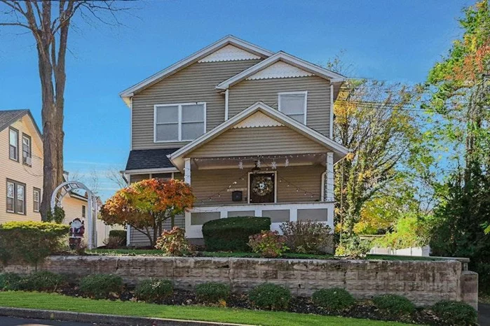 Welcome to 81 Bayberry Drive in Huntington, NY, where village charm meets modern elegance. This beautifully rebuilt home from 2011 offers a light and bright open floor plan with high ceilings and a welcoming granny porch. Featuring 3 bedrooms and 2.5 baths, including a luxurious primary suite with a walk-in closet and bath, this home is designed for comfort. The spacious living room boasts an electric fireplace, perfect for cozy evenings. The stylish white kitchen is equipped with stainless steel appliances, granite countertops, and a convenient pantry, offering tons of storage. Enjoy the versatility of a walk-out basement and the outdoor allure of a fully fenced yard with a paver patio. Private off-street parking provides room for a garage, making this home both functional and inviting. Experience the perfect blend of modern amenities and classic charm in this delightful residence just minutes from vibrant Huntington Village.