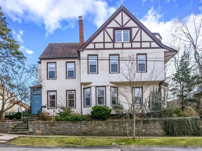 Beautifully renovated 4 level Tudor home with 5 bedrooms and 3.5 bathrooms with large fenced back yard. Quick walk to Bronxville Village, (Metro North train 30 min. to Grand Central), shops, grocery, restaurants, movie theater and NY Presbyterian/Lawrence Hospital. High ceilings, and hardwoods floors throughout. Modern large eat-in-kitchen with granite countertops and stainless steel appliances. Dining room , living room with powder room on ground floor. French doors to covered patio from the dining room perfect for entertaining onto large level garden. Central air/heat - 2 zones and central vacuum. 2nd floor: 3 bedrooms and full marble bath w/jacuzzi. 3rd floor: suite/office, 2 bedrooms with large marble bathroom w/jacuzzi & skylights. Basement: finished family room w/full bathroom, laundry, (new washer/dryer). Cooling system: SEER rating 12+. Convenient and centrally located in Lawrence Park/Sunnyside neighborhood with tree lined streets. Driveway parking as well as street parking.