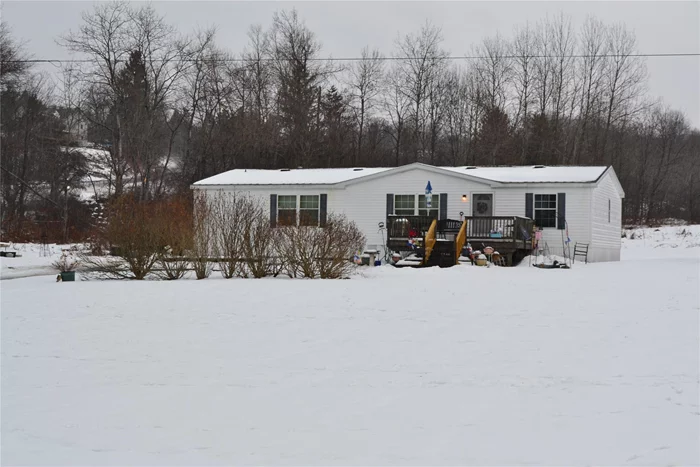 This spacious double-wide has so much to offer! Open floor plan, loaded with charm: 4 bedrooms, two full baths, all set well back on a country road just 6 miles to WALTON. One-level living that boasts an oversized living room which is open to the dining room and has lots of bright natural light and easy access to the kitchen with generous cabinets, newer appliances, a breakfast bar and separate eating area. There are 4 nice sized bedrooms but the primary is HUGE and boasts not only two large closets but, an ensuite where the full bath has both a shower and separate oval shaped tub. The front porch is perfect for relaxing and has great long-range mountain views. Level 5-acre lot surrounded by large agricultural farms. Abundant lawn area and lots of space for your gardens, a firepit, playground or new deck. 10x20 shed for gardening tools. Hi-speed internet available. Full size washer (new) & dryer. Easy commute to town for shopping, schools, highway access, restaurants and more.