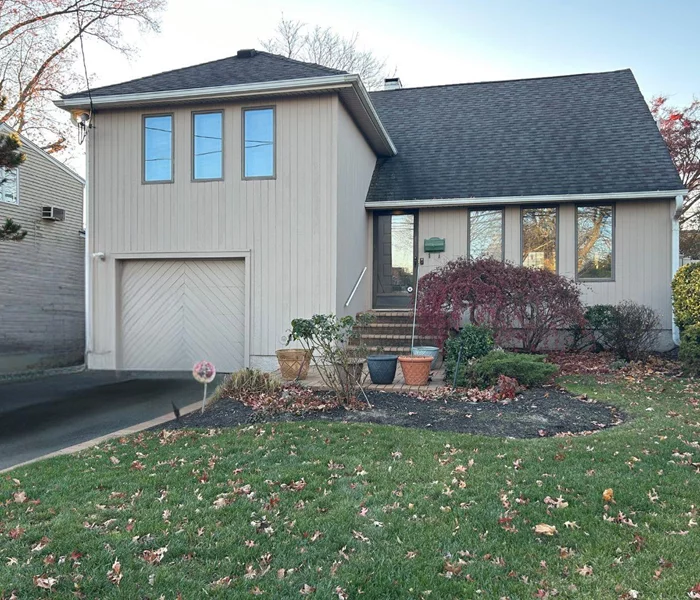 Welcome to this expanded split level home ! This home features hardwood floors throughout (in bedrooms as well), Anderson windows and doors, high hats, and crown molding. The kitchen is newly renovated featuring granite countertops and stainless steel appliances. Gas cooking for your convenience! The second level has two large bedrooms (hardwoods underneath the carpet) and a full bathroom. Third bedroom is located on the highest level, begging to be turned into your primary suite ! There is an additional bedroom on the ground level with an outside entrance. The backyard is fully fenced with a large shed and is completely usable! Located just off of Merrick road with easy access to all shops and convenience. Call today for interior photos and more information on this beautiful property!