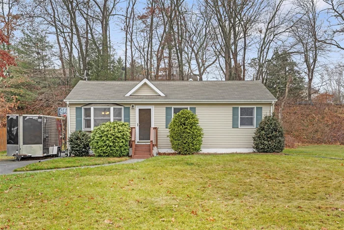 Beautifully maintained ranch-style home in the sought-after Monroe-Woodbury School District! This 3-bedroom, 2-bath gem features a spacious living room and a well-appointed kitchen with cherry-toned cabinetry and stainless steel appliances. Sun-filled, generously sized bedrooms offer comfort and charm. The lower level boasts a large family room, a second full bath, laundry area, and ample storage. Step outside to a lovely deck and backyard, perfect for outdoor fun. Nestled in a peaceful neighborhood close to shopping, schools, and major highways, this home is a must-see!