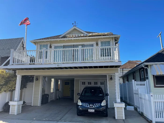 Long Beach, west end Beach Block--6 rooms -All Done New--Great room open concept : consisting of Living room, Dining room with stone counter island for dining ,  3 bedrooms, , bath, gracious front porch, two OFF STREET PARKING SPOTS  washer/dryer, so convenient to shopping, public transportation, restaurants, and the OCEAN, park,