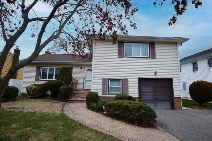 Move right into this Split-Level home located on a neatly manicured mid-block lot in Barnum Woods. This well-maintained home offers 3 bedrooms, 2.5 bathrooms, an attached one-car garage, and a spacious back yard. The main level features a large, bright living room, a formal dining area, and a sun-filled eat-in kitchen with updated cabinets and sliders leading out to the yard. The upper level includes the primary bedroom with its own updated private bathroom, two additional bedrooms, and a full bathroom in the hallway. The comfortable den on the lower level has access to a half bath, 1 car garage, laundry and side yard entrance, a perfect space for casual get-togethers or use as a guest area. You&rsquo;ll also find ample storage space in the unfinished basement which is ready for your personal touch. The back yard with mature shrubs and trees offers the ideal setting to enjoy entertaining, gardening, lawn games, or just relaxing. This home is Located close to the 930-acre Eisenhower Park with golf courses, a pool, many ball fields, playgrounds and skating rinks. Also, many options for grocery stores, eateries, schools, close to the Meadowbrook and Southern State Parkways making for an easy commute and quick access to South Shore beaches. All the elements needed for comfortable everyday living.