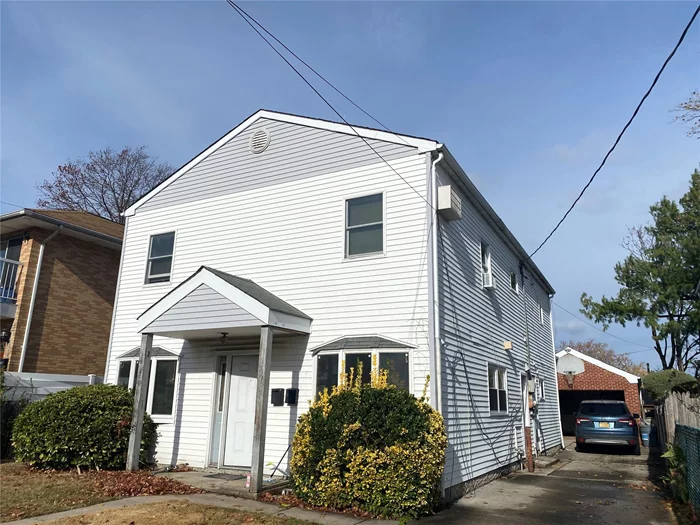 Lovely 3 Bedroom With Spacious Living Room, New Windows, New New Floors. Washer And Dryer In Unit. Garage and Driveway Included. Beautiful Backyard. 26 School District. Ps 221, MS. 67. Great Location And Convenient To All.