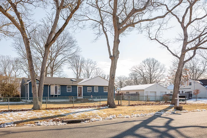 This Wideline Ranch, located in Shirley Tangiers, is set on a spacious, fenced, park-like property. This excellent home features four bedrooms, three and a half bathrooms, and a fully finished basement. It boasts newer appliances, hardwood floors, and several Anderson windows. A brand new Rheem 40-gallon electric water heater has been installed, and the heating system includes a Weil-McLain burner with a Beckett burner. The electrical system was upgraded to 200 amps in December 2023. Additionally, there are four sheds on the property, providing ample storage space.