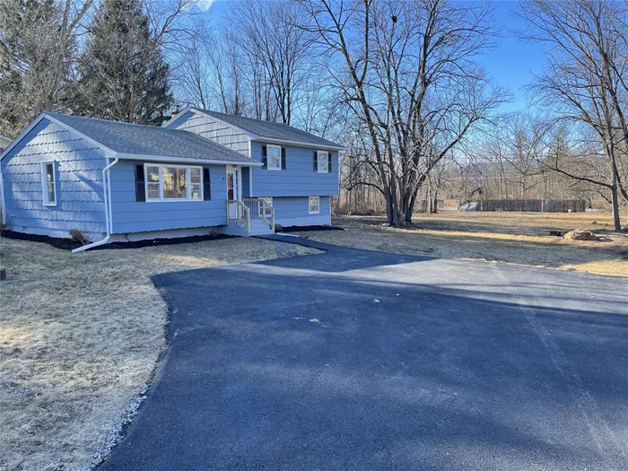 Completely remodeled split level in the charming town of Gardiner. Situated one acre of beautiful land, this stunning property spans 1788 square feet, and boasts an open-concept main level with refinished hardwood flooring. Completed remodeled kitchen with granite countertops, brand-new stainless-steel appliances, new cabinets, back splash and ceramic flooring. Upper-level features 3 good sized bedrooms and a fully renovated full bath with porcelain walls and marble mosaic tile floors, new vanity, toilet and soaking bathtub. Lower-level features waterproof vinyl plank flooring, a large family room, and a master bedroom with renovated full bath. Strategically located within walking distance to restaurants, library, and shopping. And just 10 minutes away from New Paltz State University of New York and 15 minutes away from Minnewaska State Park.