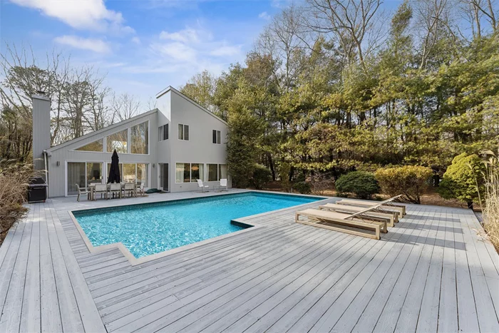 Quogue Modern with Pool! 24 Quogue Riverhead Road, a refreshed contemporary with lofty ceilings and an open airy feel is the perfect perch for the extended summer season. With three bedrooms and three baths on two floors, everyone can spread out and find their space. The large great room has seating spaces for large groups and small: a large sectional sits in front of the wood burning fireplace while a cozier seating nook provides a large screen TV. The kitchen is sleek and upgraded with concrete counters and stainless steel appliances. For dining options a table for 8 overlooks the 1/2 acre yard, or take the party poolside with a new grill and teak dining table. There are three bedrooms: a queen bed on the first floor with a nearby full bath. Upstairs is the second bedroom with two twins (or option to combine to a king). The primary suite has a king sized bed and a sleek bathroom with oversized walk-in shower with soaking tub. Skylights throughout bring the sunshine inside (when you&rsquo;re not lounging by the sunny pool). 24 Quogue Riverhead Road is a mile from the beautiful Quogue Wildlife Refuge, 2 Miles from the Quogue Village Shops and 3 miles from the Quogue Village Beach. Renters can obtain passes to access both Quogue&rsquo;s Village Beach and Southampton Town Beaches. Easy access to 27 East and only 80 miles to midtown Manhattan.