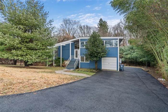 This house is a perfect house for those who love to entertain. It was recently renovated to make it an open floor plan concept with cathedral ceilings, natural light, oversized deck with a 1-year-old 16 x 16 heated pool. It also has a family room leading to the deck and pool area.  Installed in the garage is Telsa Supercharger. The large, finished basement has 10 ft ceilings also with storage and utility room. This house was 4 bedrooms and 3 full bathrooms. It is a must see.