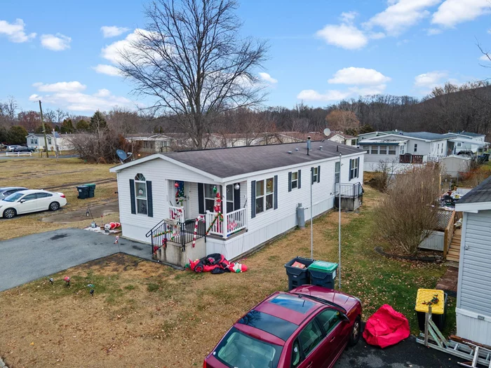 WELCOME TO WASHINGTONVILLE MANOR!!! Discover this charming 3-bedroom, 2-bathroom mobile home situated in the Washingtonville Manor community. Nestled in the heart of the Village of Washingtonville and within the highly-regarded Washingtonville School District, this home offers both comfort and convenience. Enjoy being just moments away from local shopping, banking services, parks, and schools. Plus, with easy access to Interstate 87, exploring the surrounding area is a breeze. If the location isn&rsquo;t enough check out the amenities this home has to offer starting with the kitchen boasting an abundant of oak cabinetry, stainless steel appliances, laminate countertops with a granite-like appearance, and a stylish stone-look tile backsplash. The wood-look laminate flooring extends throughout the main living areas, enhancing the homeâ€™s warmth and charm. The primary bedroom offers cozy wall-to-wall carpeting and a private en-suite bathroom with a convenient shower stall. Down the hall, youâ€™ll find two additional bedrooms and a dedicated laundry room for added functionality. Don&rsquo;t pass this opportunity by, call now for your showing!!!